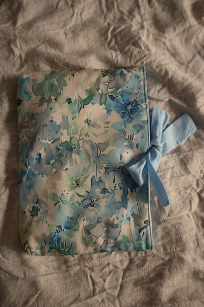 Decorative book sleeve with a bow gift.