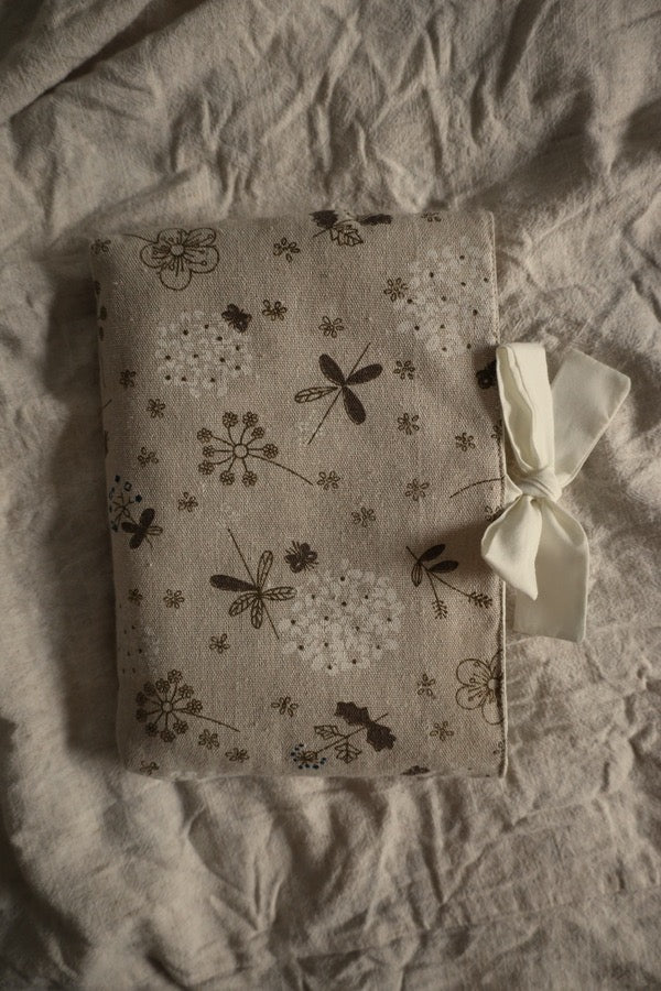 Decorative book sleeve with a bow gift.