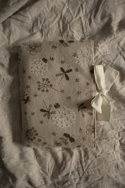 Decorative book sleeve with a bow gift.