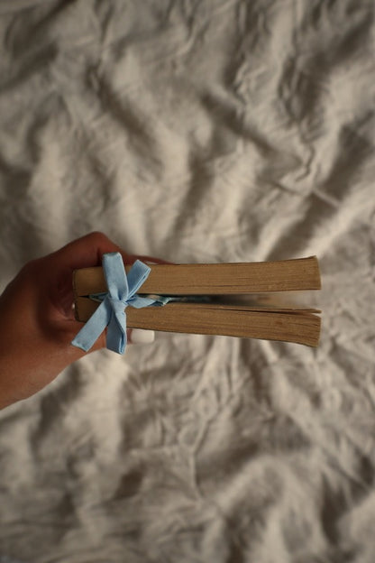 Preloved book with matching bookmark with blue bow.